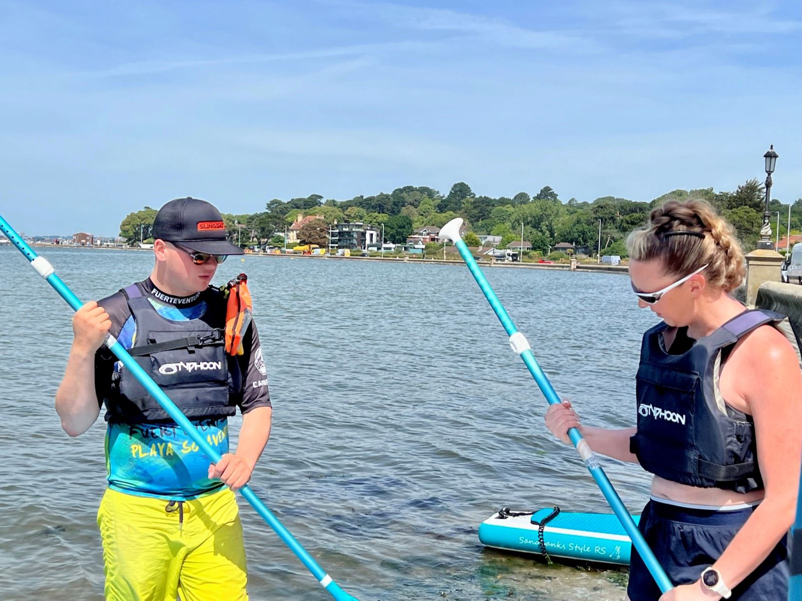 Woman learning to paddleboard 